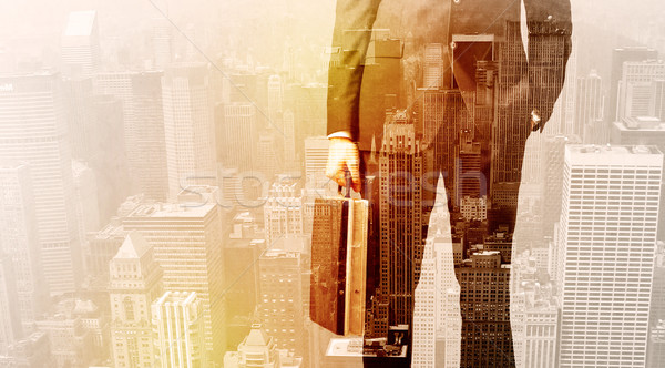 Business man looking at overlay city background Stock photo © ra2studio