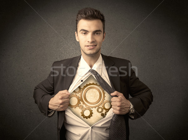 Businessman tearing shirt off and machine cog wheel shows Stock photo © ra2studio