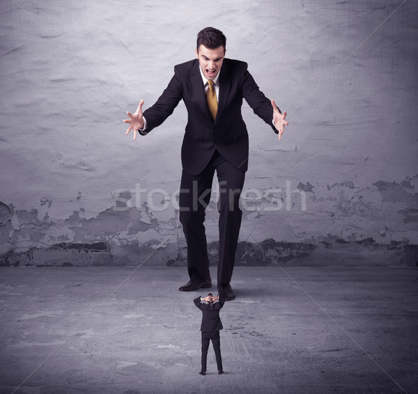 Angry big manager looking at small business man Stock photo © ra2studio