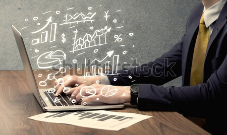 Business man drawing charts with laptop Stock photo © ra2studio