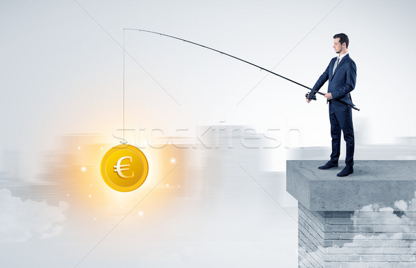 Businessman fishing coins concept Stock photo © ra2studio