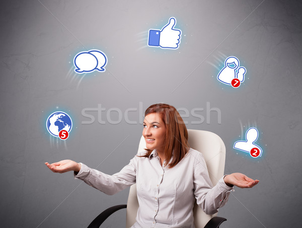 Atraente mulher jovem malabarismo rede social ícones sessão Foto stock © ra2studio