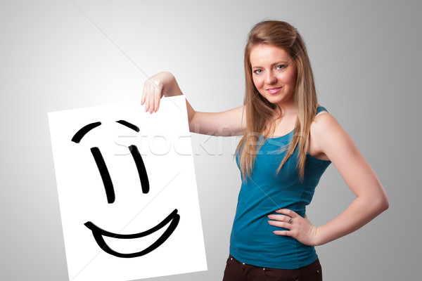 Fiatal nő tart mosolygós arc rajz vonzó nő Stock fotó © ra2studio