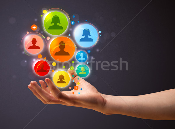 Social network icons in the hand of a businessman Stock photo © ra2studio