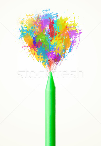 Colored paint splashes coming out of crayon Stock photo © ra2studio