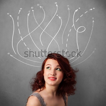 Young woman with arrows coming out of her head Stock photo © ra2studio