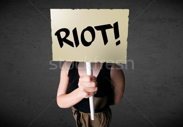 Young woman holding a protest sign Stock photo © ra2studio