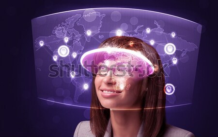 Jeune femme regarder futuriste réseau social carte ordinateur [[stock_photo]] © ra2studio