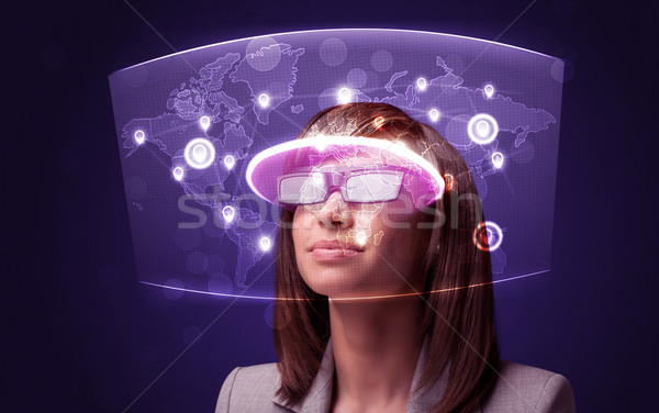 Jeune femme regarder futuriste réseau social carte ordinateur [[stock_photo]] © ra2studio