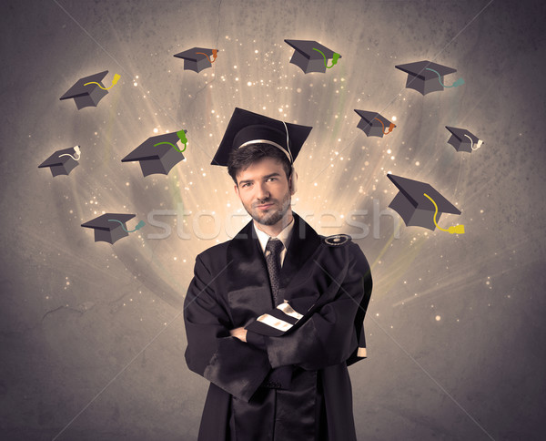 College graduate with many flying hats Stock photo © ra2studio
