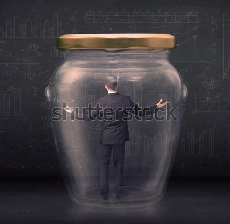 Stock photo: Businesswoman captured in a glass jar concept