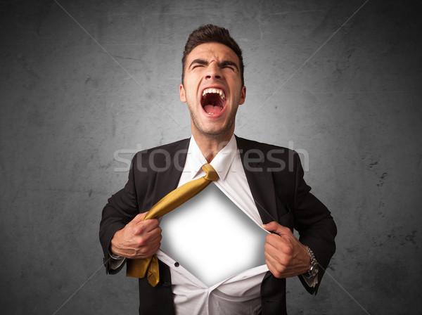 Businessman tearing off his shirt with white copyspace on chest Stock photo © ra2studio