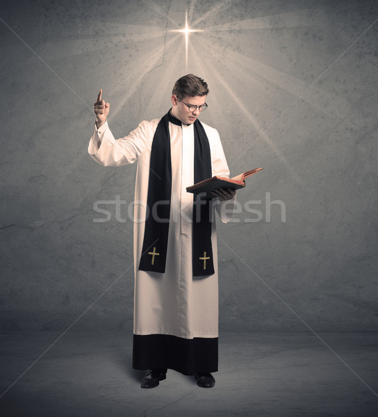Młodych kapłan błogosławieństwo mężczyzna czarno białe szary Zdjęcia stock © ra2studio