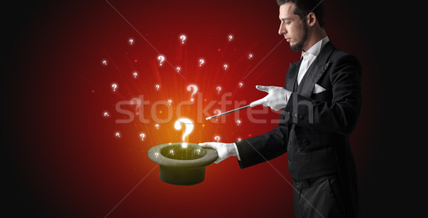 Magician conjure question signs from a cylinder Stock photo © ra2studio
