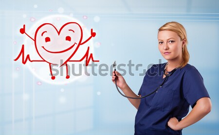 Pretty young nurse in hospital listening to empty copy space with sthetoscope Stock photo © ra2studio