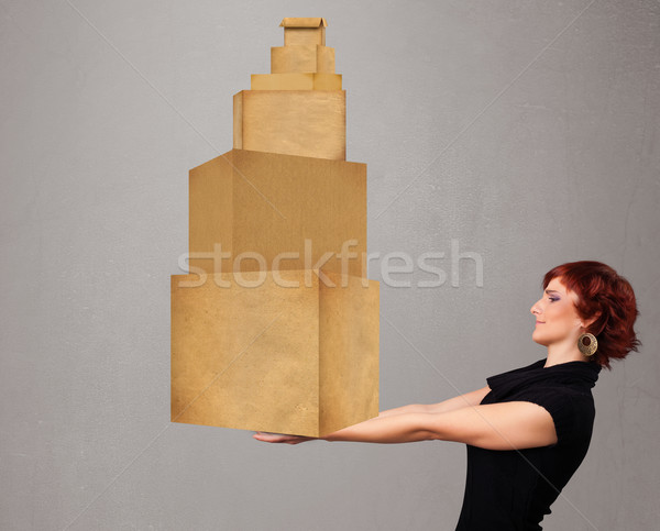 Young lady holding a set of brown cardboard boxes Stock photo © ra2studio