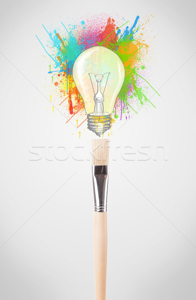 Brush close-up with colored paint splashes and lightbulb Stock photo © ra2studio