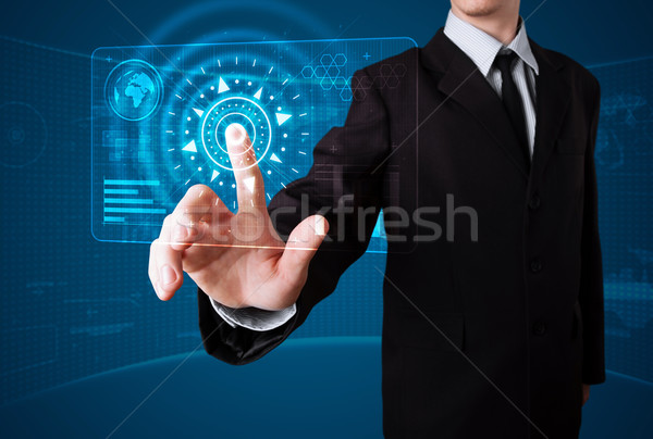 Businessman pressing high tech type of modern buttons Stock photo © ra2studio