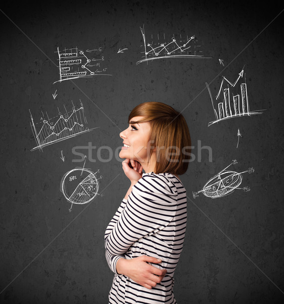 Stock photo: Young woman thinking with charts circulation around her head