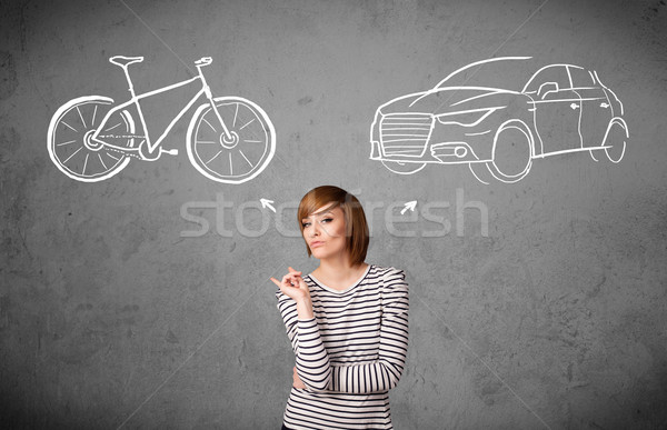 Woman making a choice between bicycle and car Stock photo © ra2studio