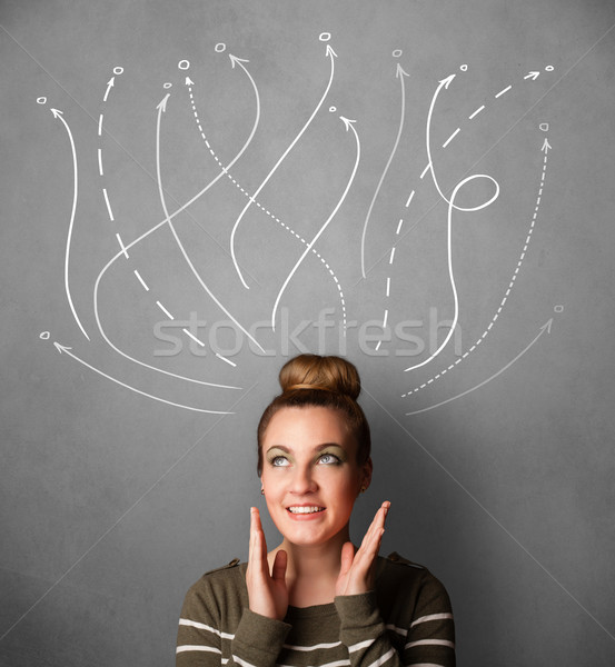 Young woman with arrows coming out of her head Stock photo © ra2studio