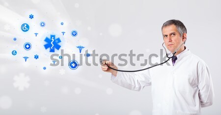 Doctor listening to empty copy space with stethoscope Stock photo © ra2studio