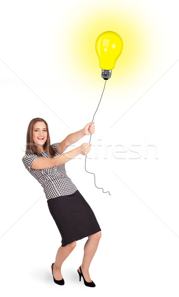 Heureux femme ampoule ballon jeune femme [[stock_photo]] © ra2studio