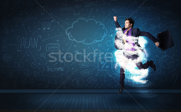 Heureux homme d'affaires sautant tempête nuage autour [[stock_photo]] © ra2studio