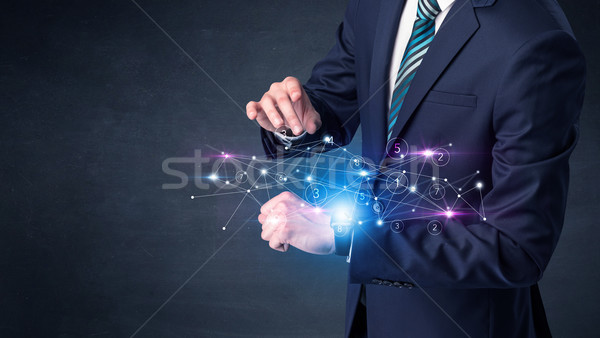 Hálózatok férfi visel kéz technológia üzletember Stock fotó © ra2studio