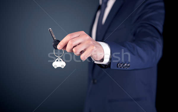 Young man hand over keys  Stock photo © ra2studio