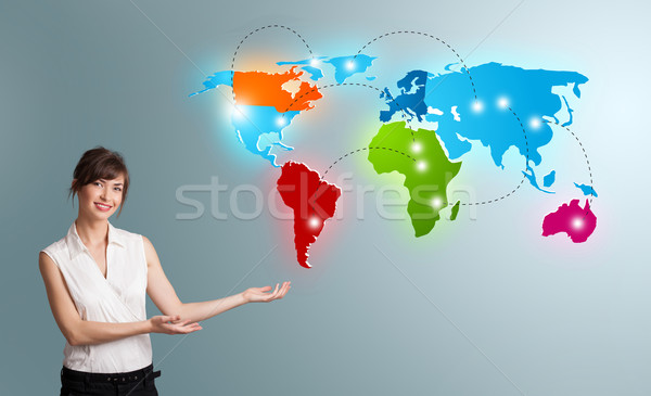 Young woman presenting colorful world map Stock photo © ra2studio