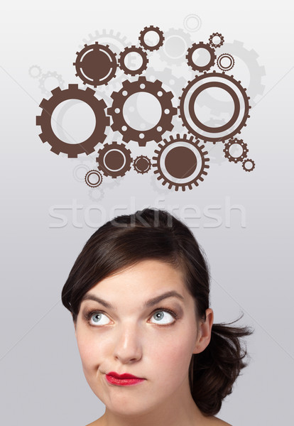 Young girl looking at idea type of sign Stock photo © ra2studio