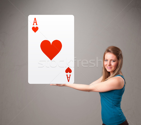 Beautifu woman holding a red heart ace Stock photo © ra2studio