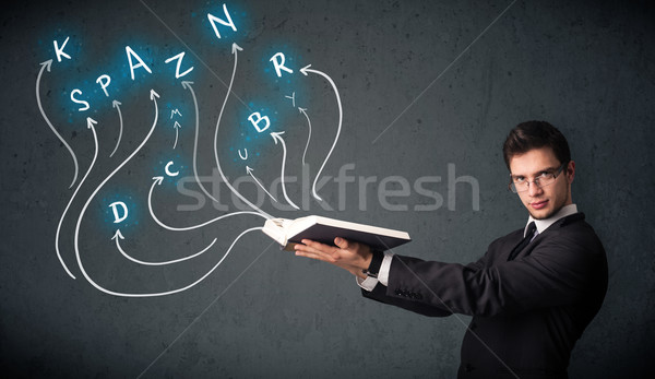 Young man reading a book while multiple choices are coming out of the book Stock photo © ra2studio