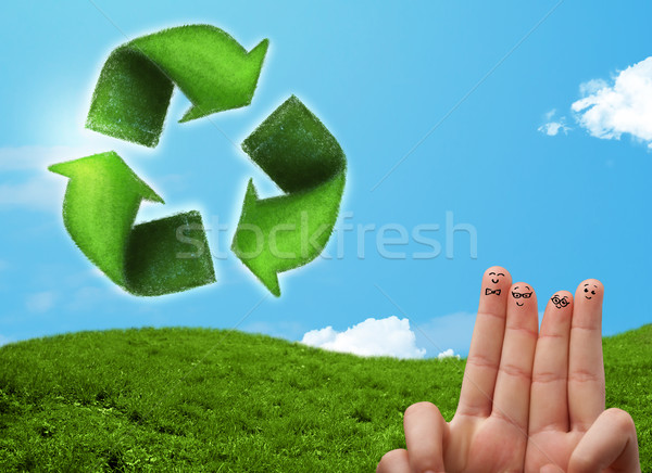 Happy smiley fingers looking at green leaf recycle sign Stock photo © ra2studio