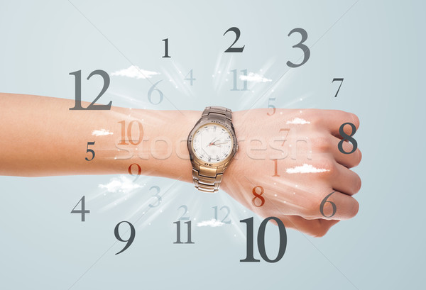 Hand with watch and numbers on the side comming out Stock photo © ra2studio