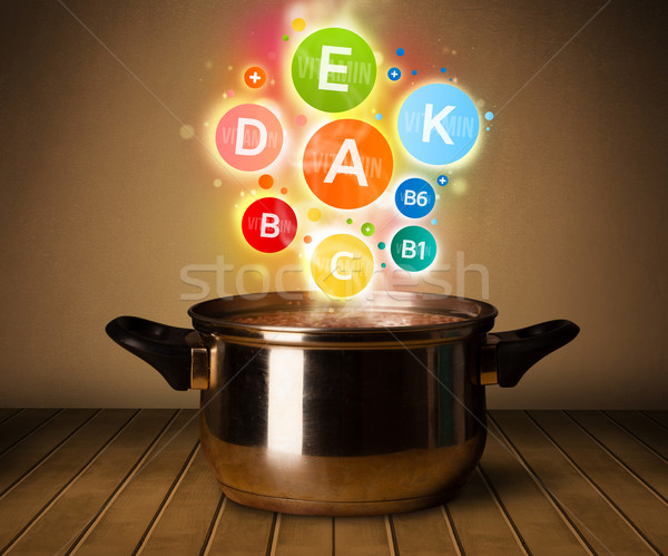 Colorful vitamins coming out from cooking pot Stock photo © ra2studio