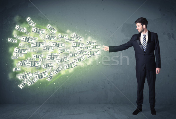 Business person throwing a lot of dollar bills concept Stock photo © ra2studio