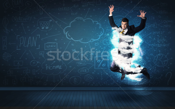 Heureux homme d'affaires sautant tempête nuage autour Photo stock © ra2studio