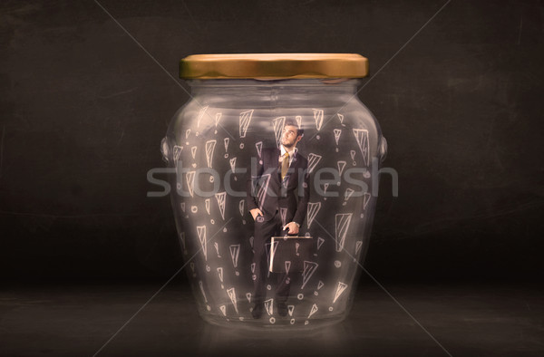 Business man trapped in jar with exclamation marks concept Stock photo © ra2studio