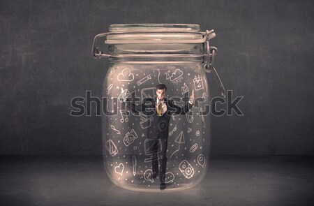 Business man captured in glass jar with hand drawn media icons c Stock photo © ra2studio