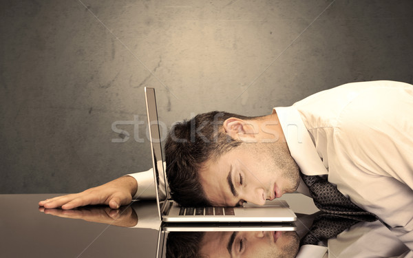 Frustrated businessman's head on keyboard Stock photo © ra2studio