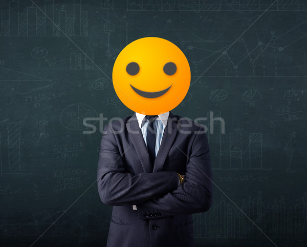 businessman wears yellow smiley face Stock photo © ra2studio