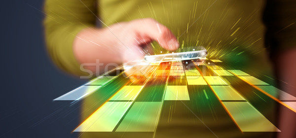 Woman holding smartphone with futuristic lines  Stock photo © ra2studio