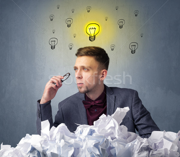 Businessman behind crumpled paper Stock photo © ra2studio