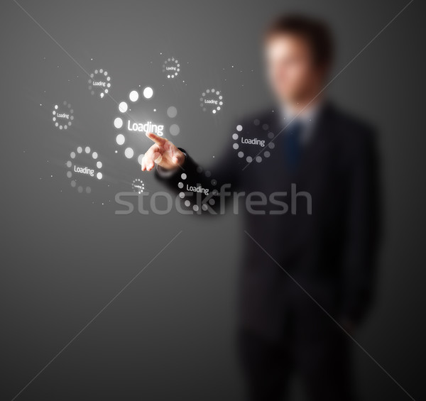 Businessman pressing simple type of start buttons Stock photo © ra2studio