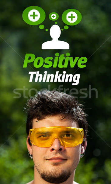 Jóvenes cabeza mirando positivo negativos signos Foto stock © ra2studio