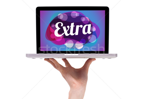 Stock photo: a male hand holding a laptop with extra sign