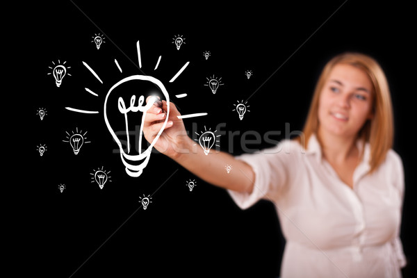 Vrouw tekening gloeilamp jonge vrouw business Stockfoto © ra2studio