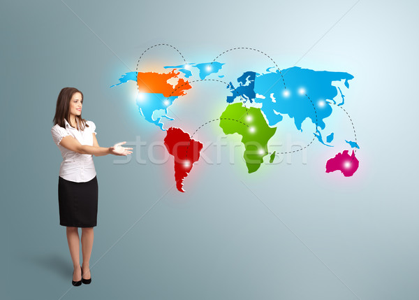 Young woman presenting colorful world map Stock photo © ra2studio